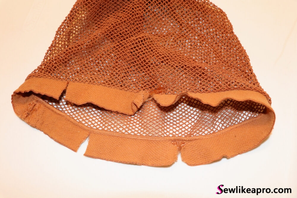 fishnet tights with snipped waistband in four places