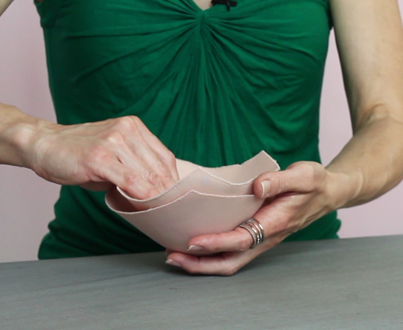 Hot glue two bust cup shells together for firm bust support in women's competition ballroom dance and figure skating dresses.