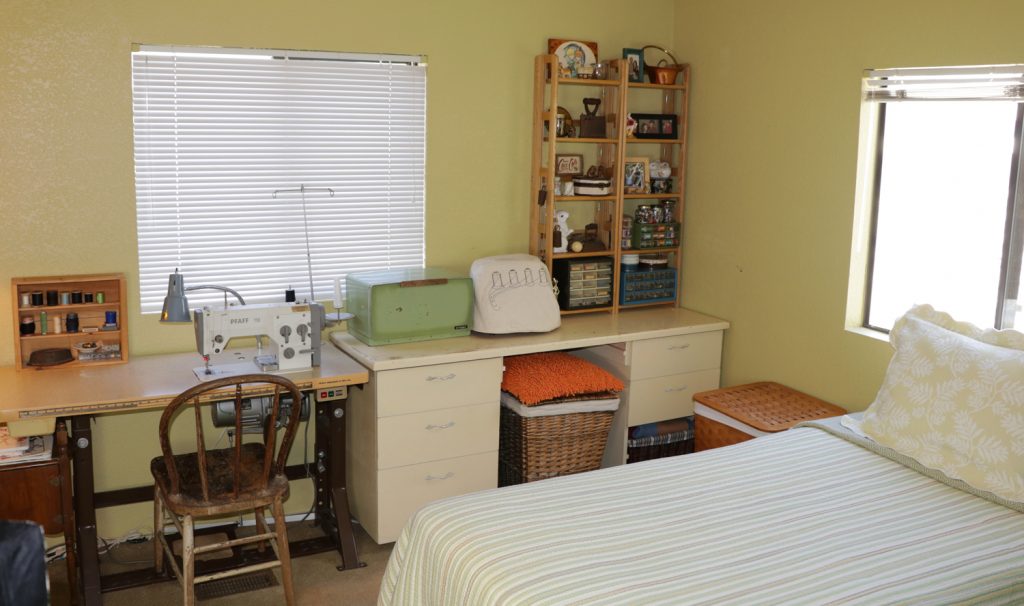 home sewing room that doubles as a guest bedroom
