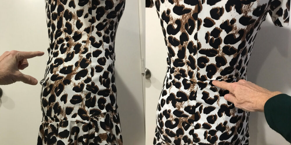 carol points to wrinkles in back panel of practicewear dress