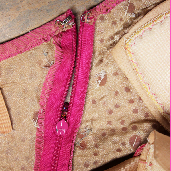 line stretch mesh with flesh color lycra so rhinestone glue sticks to fabric better, invisible zipper, bra cups