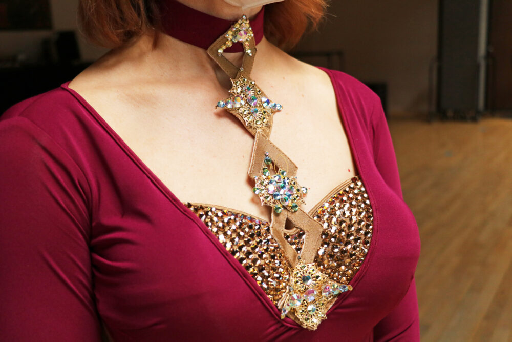 closeup of diamond neckline applique and V neckline