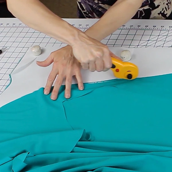 Learn to adjust spandex fabric according to how much it stretches.  Cut lycra sleeve for ballroom dance dresses and adult ice skating dress