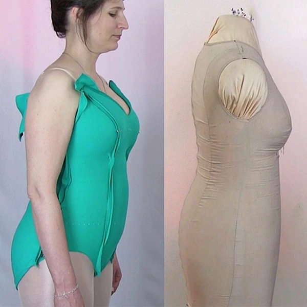 Human female form compared in shape and body curves with a dress form that is similar measurements.  Stretch lycra leotard for dance and skate costumes