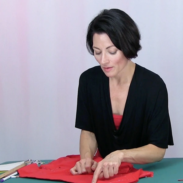 Teresa Sigmon makes dress alterations for a Latin, Skate Ballroom performance costume body suit.