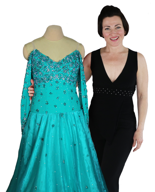 Teresa Sigmon is the creator of the Ballroom Dressmaker School and all things, Sew Like A Pro™.  She stands with a Standard ballroom dance dress lace motifs chiffon organza skirt, that is one of the dresses featured as the 