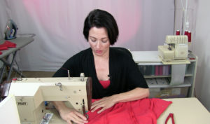 Teresa basting a lycra body suit. Sew Like A Pro™, the online sewing school for Dancesport, Country and Skate Dresses, created by Teresa Sigmon