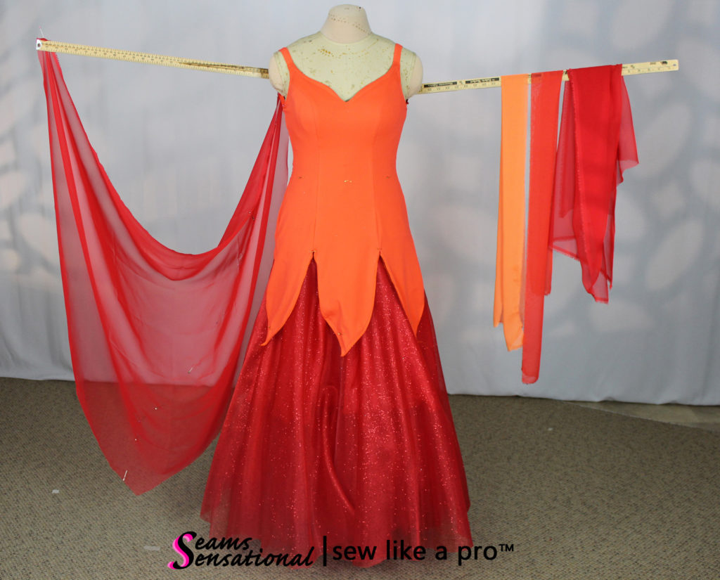 red Standard float with multi color drapes on left arm